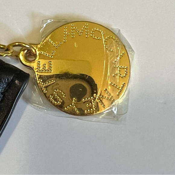 Stella McCartney NWOT Black Logo Zip Pouch Wristlet Gold Medallion Clutch